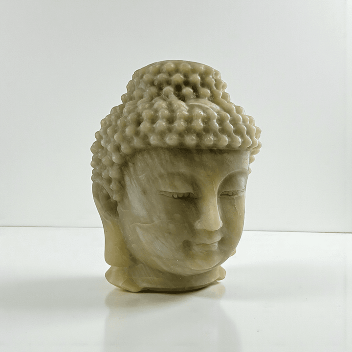 Polished jade crystal Buddha head statue statement piece for meditation space. available at zen collection Canadian metaphysical store near me Barrie