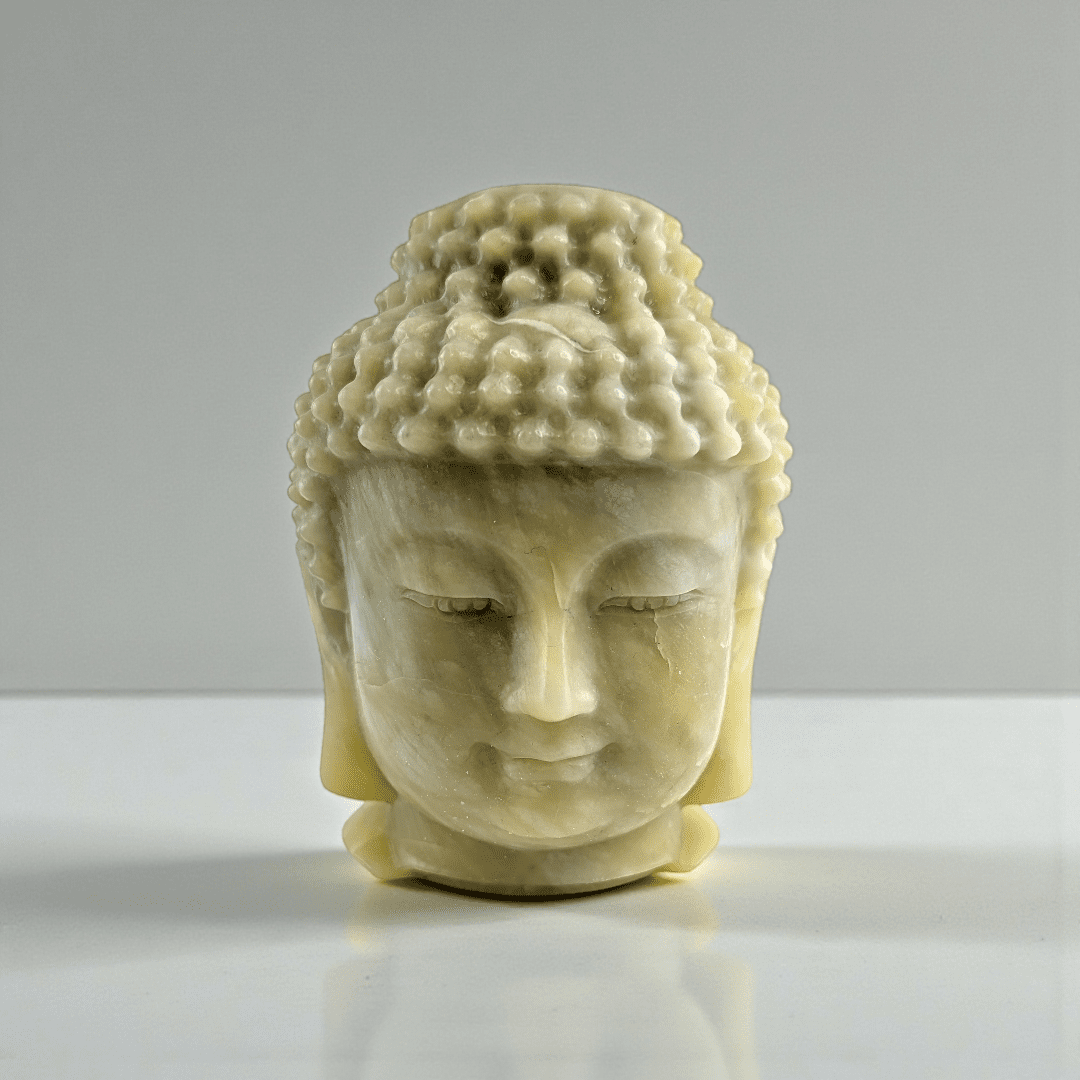Polished jade crystal Buddha head statue statement piece for meditation space. available at zen collection Canadian metaphysical store near me Barrie