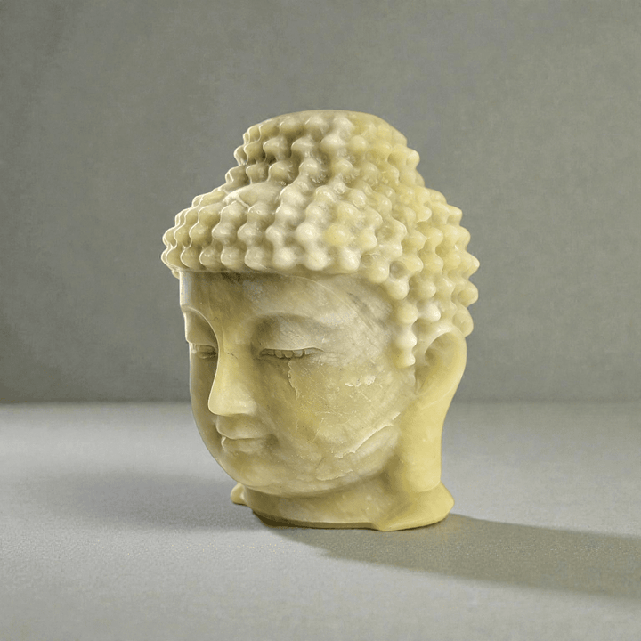 Polished jade crystal Buddha head statue statement piece for meditation space. available at zen collection Canadian metaphysical store near me Barrie