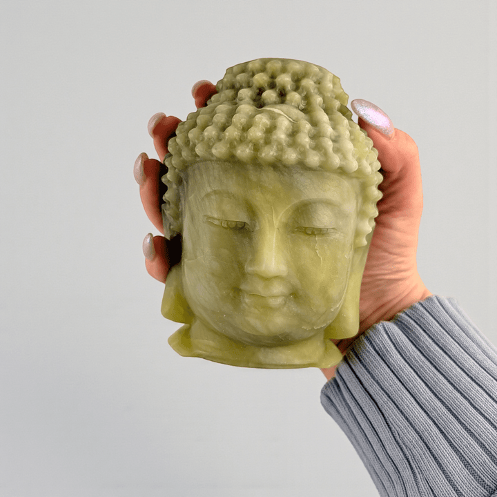 Polished jade crystal Buddha head statue statement piece for meditation space. available at zen collection Canadian metaphysical store near me Barrie