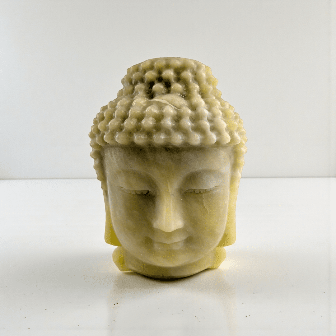 Polished jade crystal Buddha head statue statement piece for meditation space. available at zen collection Canadian metaphysical store near me Barrie