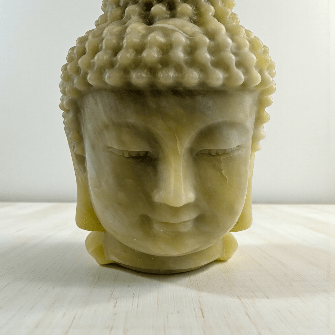 Polished jade crystal Buddha head statue statement piece for meditation space. available at zen collection Canadian metaphysical store near me Barrie
