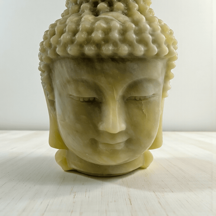 Polished jade crystal Buddha head statue statement piece for meditation space. available at zen collection Canadian metaphysical store near me Barrie