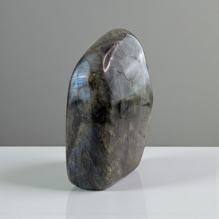 Third eye Labradorite stone on a gray background available at Zen Collection Metaphysical Store in Barrie Ontario. Shop In-store or Online Now 