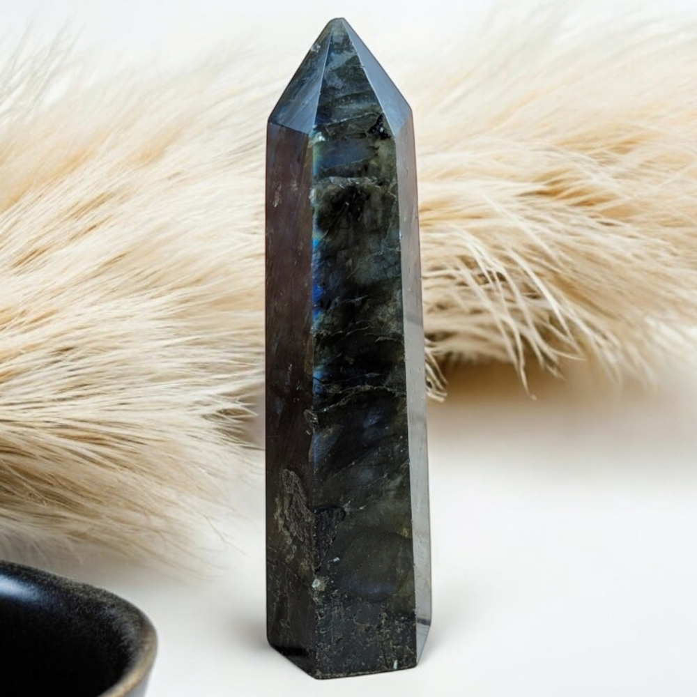 Side view of Labradorite Tower reflecting light in a sacred space.