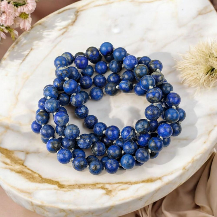 Genuine Lapis Lazuli mala beads for throat and third eye chakra. Shop in-store or online now with Zen Collection Canadian crystal store