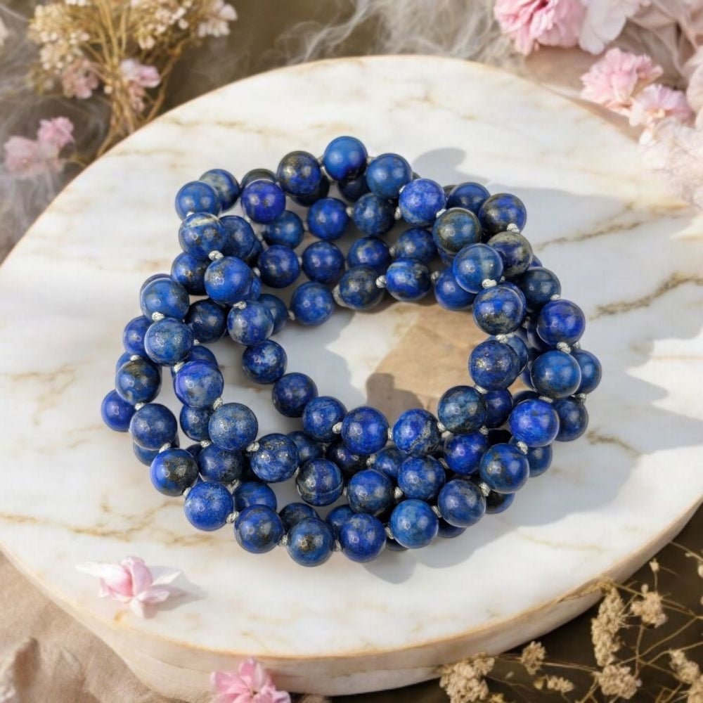 Genuine Lapis Lazuli mala beads for throat and third eye chakra. Shop in-store or online now with Zen Collection Canadian crystal store