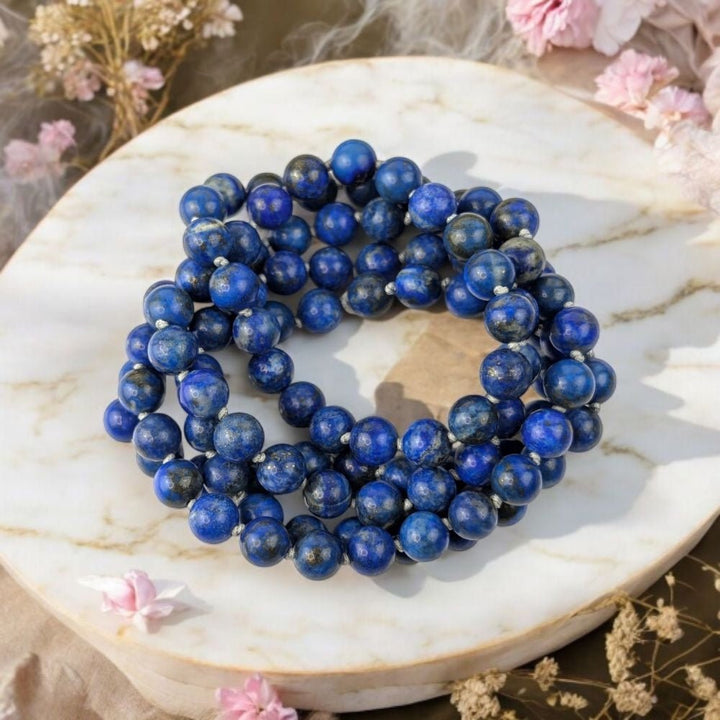 Genuine Lapis Lazuli mala beads for throat and third eye chakra. Shop in-store or online now with Zen Collection Canadian crystal store