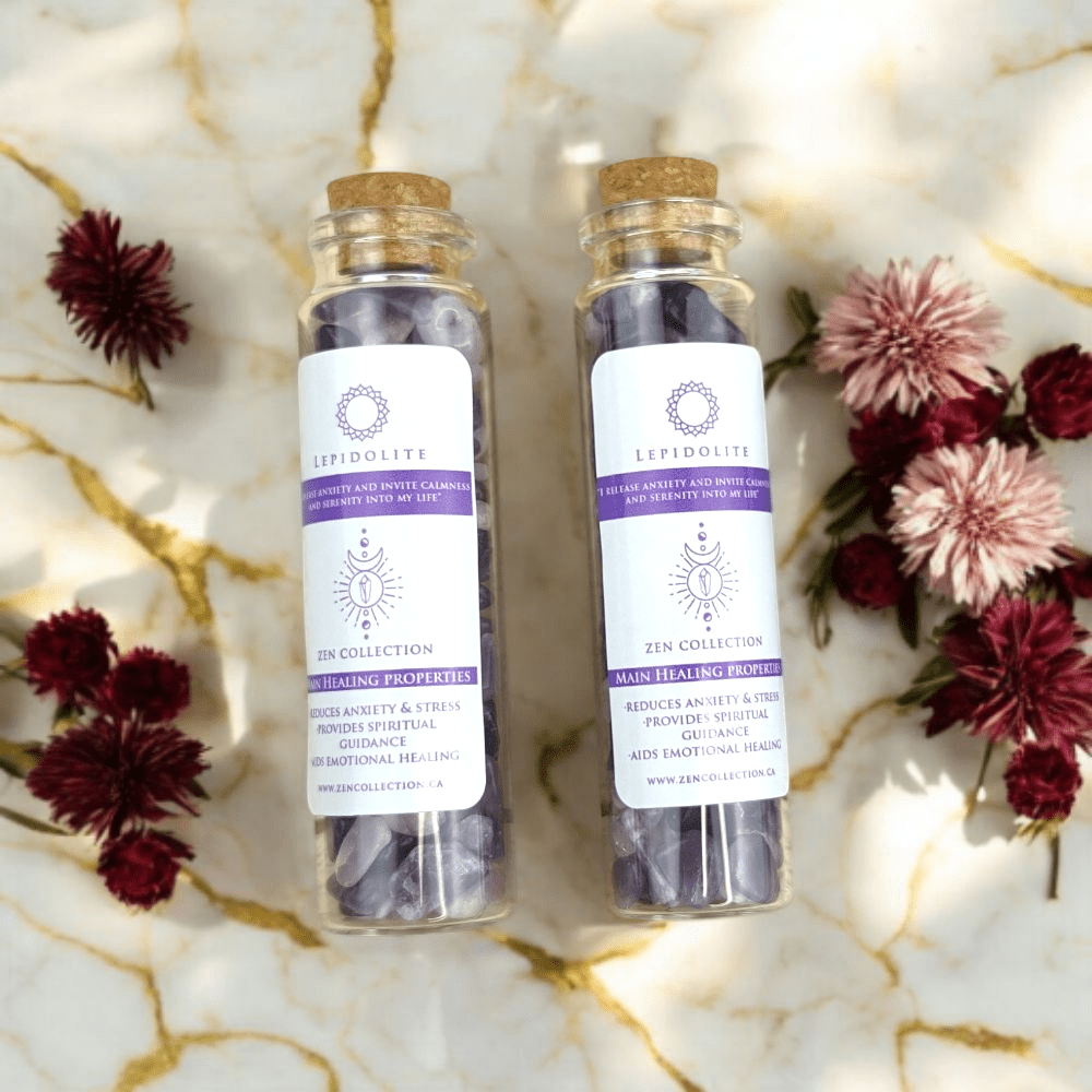 Two bottles of Lepidolite crystals on a decorative background with flowers