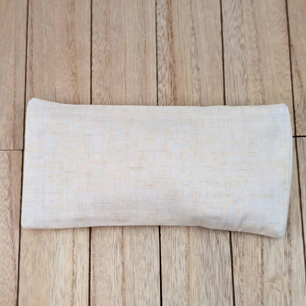 Weighted eye pillow with flaxseed filling in light sand