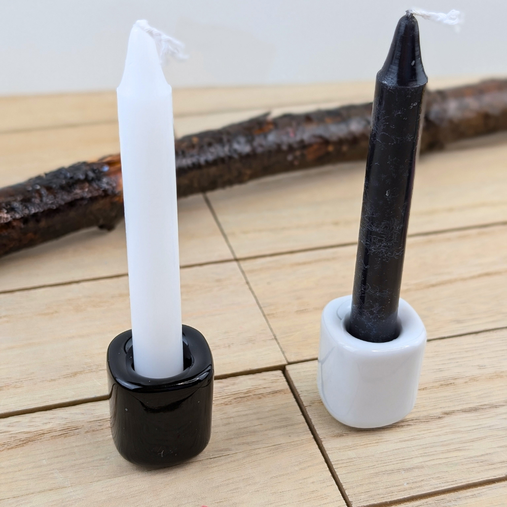 Black and white candles for intention-setting and meditation