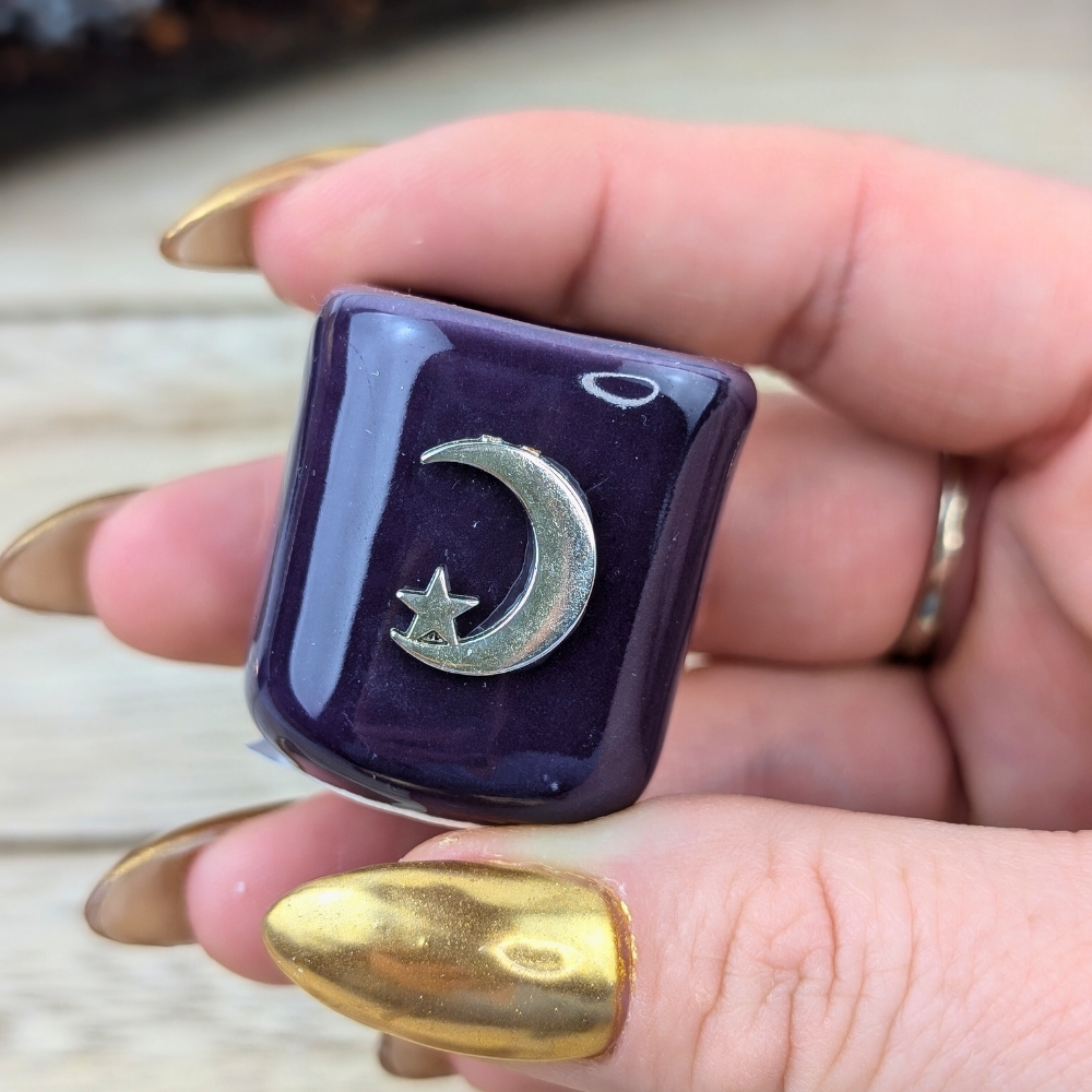 Ceramic ritual candle holder in deep purple with crescent moon