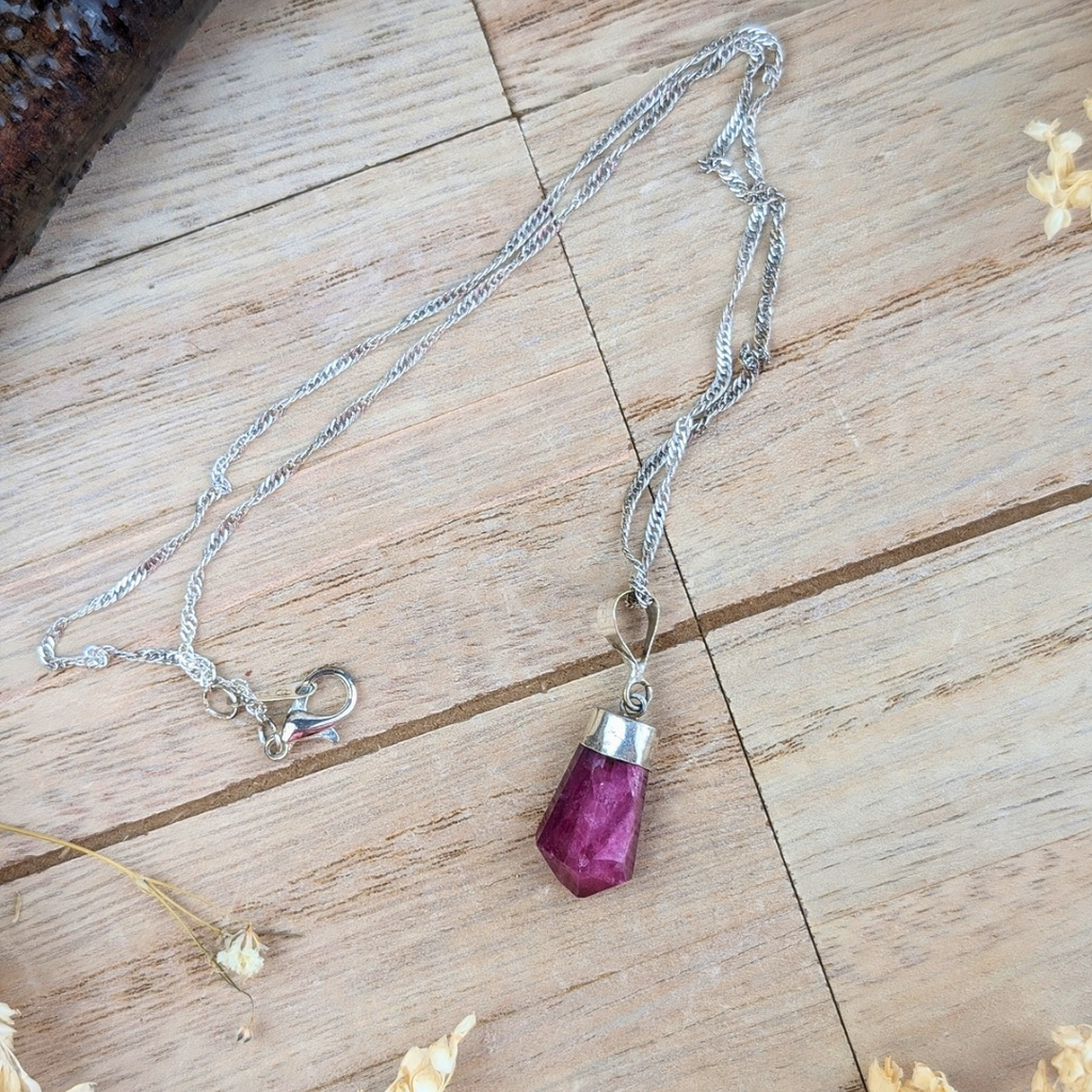 Close-up of Natural Ruby Necklace Pendant - A detailed view of the ruby stone, emphasizing its rich, red color and smooth, polished surface.