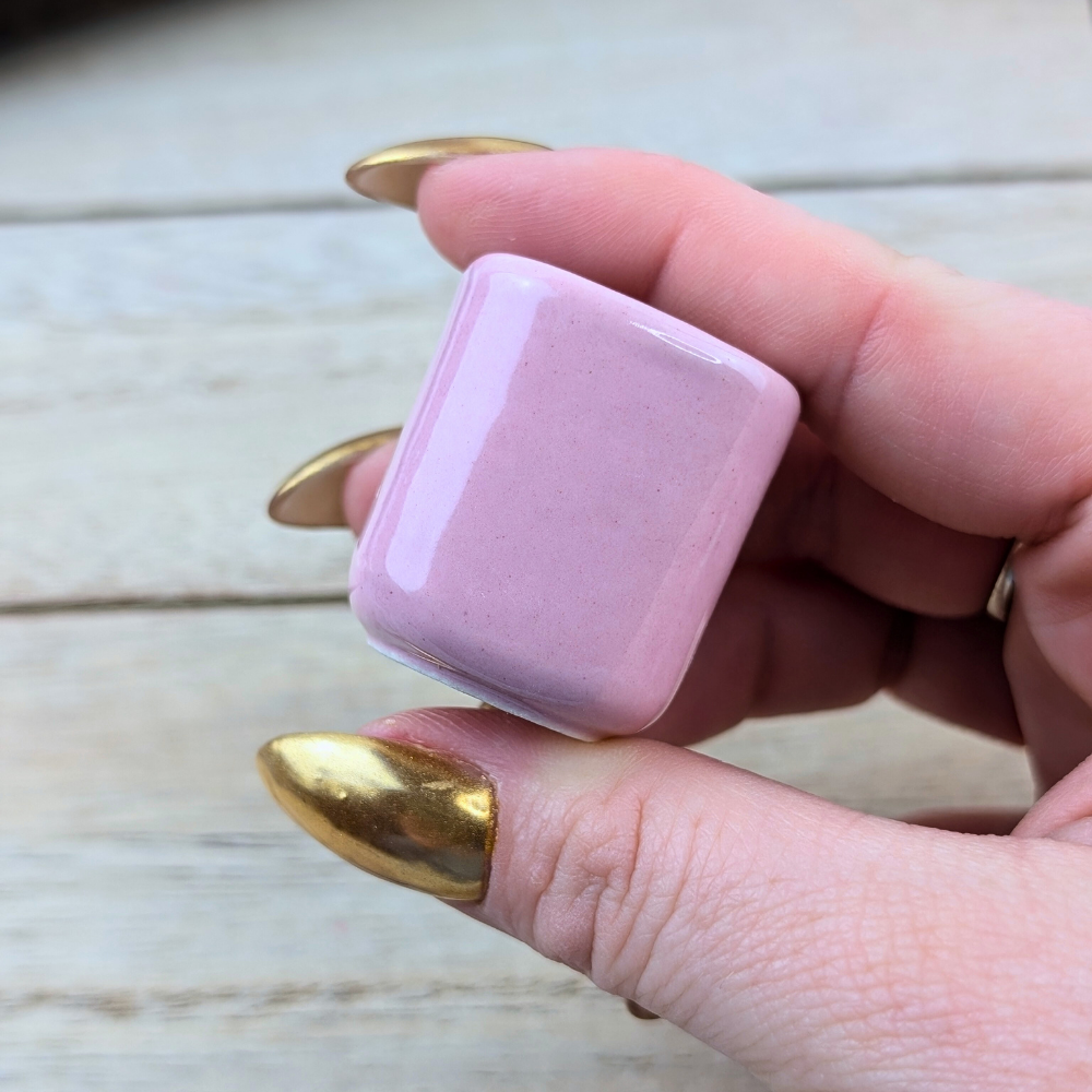 Compact pink candle holder for meditation and intention setting