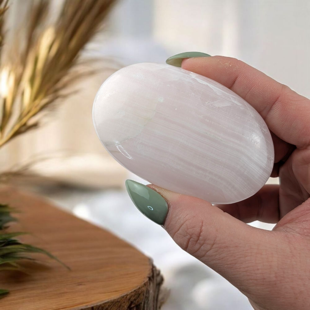 Pink Mangano Calcite palm stone from crystal shop