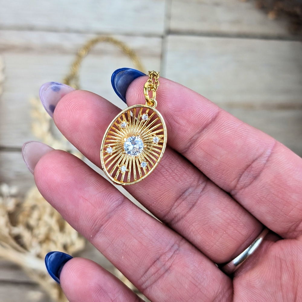 Celestial sunburst necklace, metaphysical jewelry for inner strength and light.