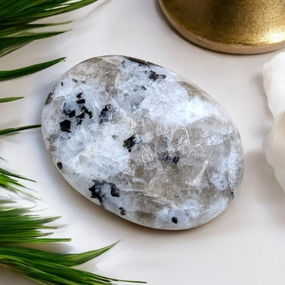 Rainbow Moonstone Crystal Palm Stone with luminous flashes.