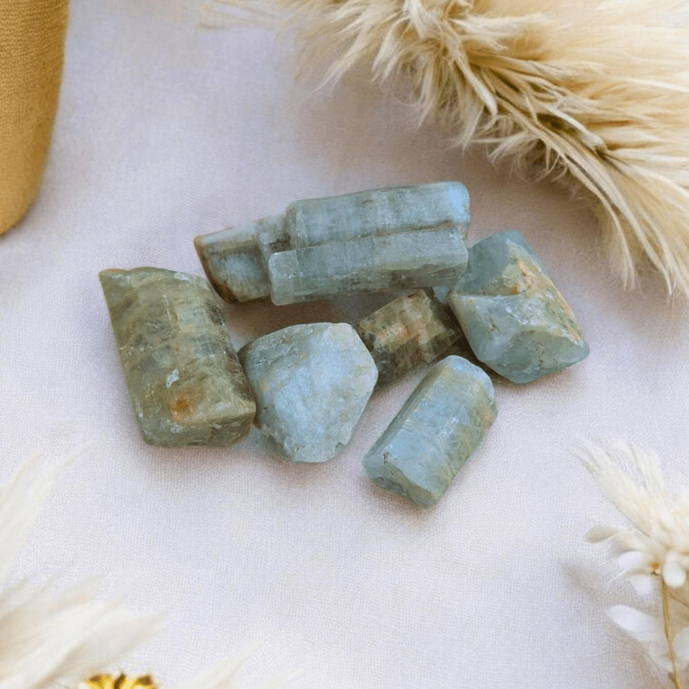 Medium-Large raw aquamarine chunks showcasing greenish blue tones.