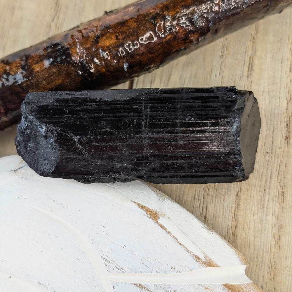 Close-up of Black Tourmaline Crystal - A detailed close-up of the Black Tourmaline stone, highlighting its deep black color and protective energy.