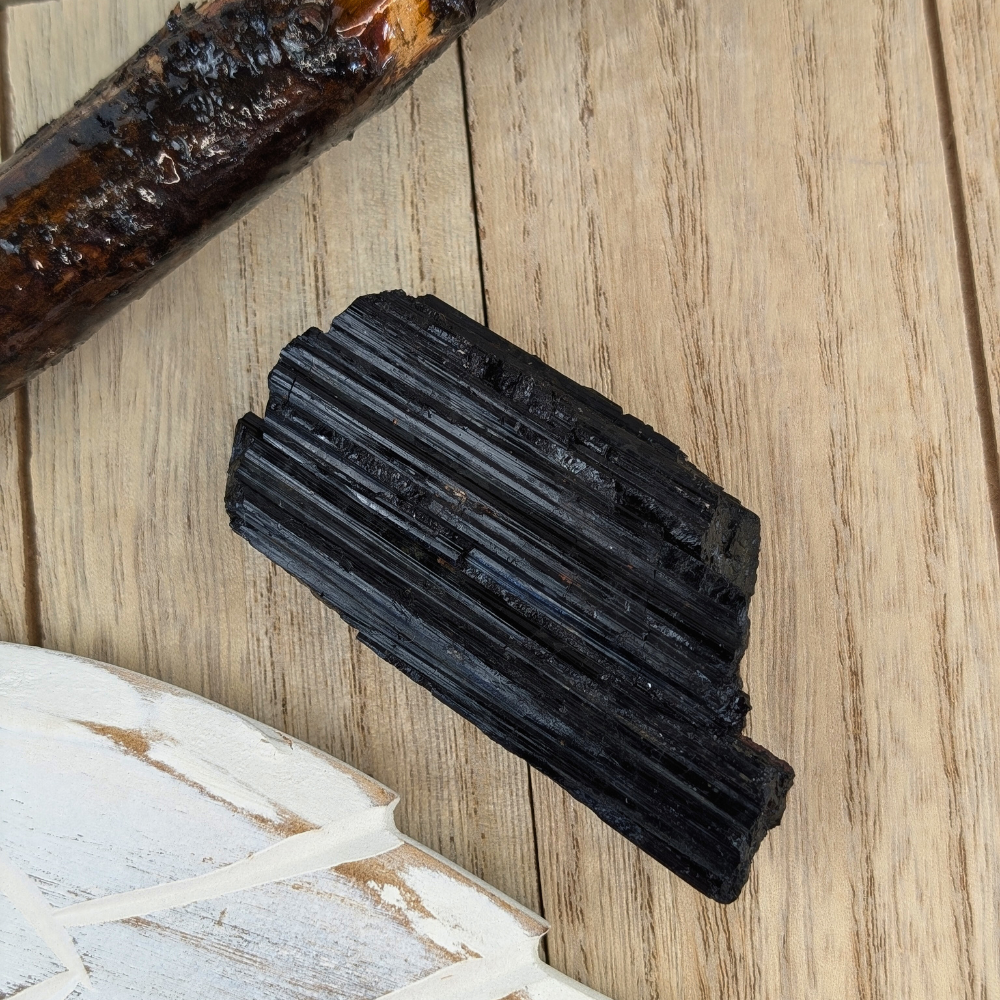 lack Tourmaline Chunk for Grounding - A handheld Black Tourmaline chunk, demonstrating its size and use in grounding practices during meditation or daily life.