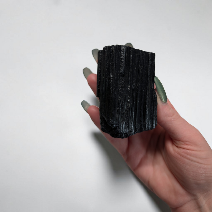 Raw Black Tourmaline Crystal for the root chakra and negative energy protection. Find in-store now or online at Zen Collection Metaphysical Store Canada