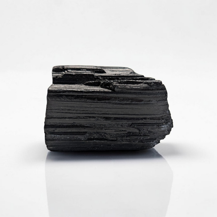 Raw Black Tourmaline Crystal for the root chakra and negative energy protection. Find in-store now or online at Zen Collection Metaphysical Store Canada