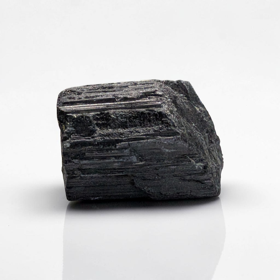 Raw Black Tourmaline Crystal for the root chakra and negative energy protection. Find in-store now or online at Zen Collection Metaphysical Store Canada