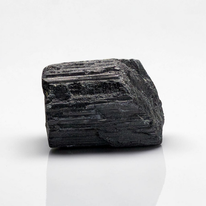 Raw Black Tourmaline Crystal for the root chakra and negative energy protection. Find in-store now or online at Zen Collection Metaphysical Store Canada