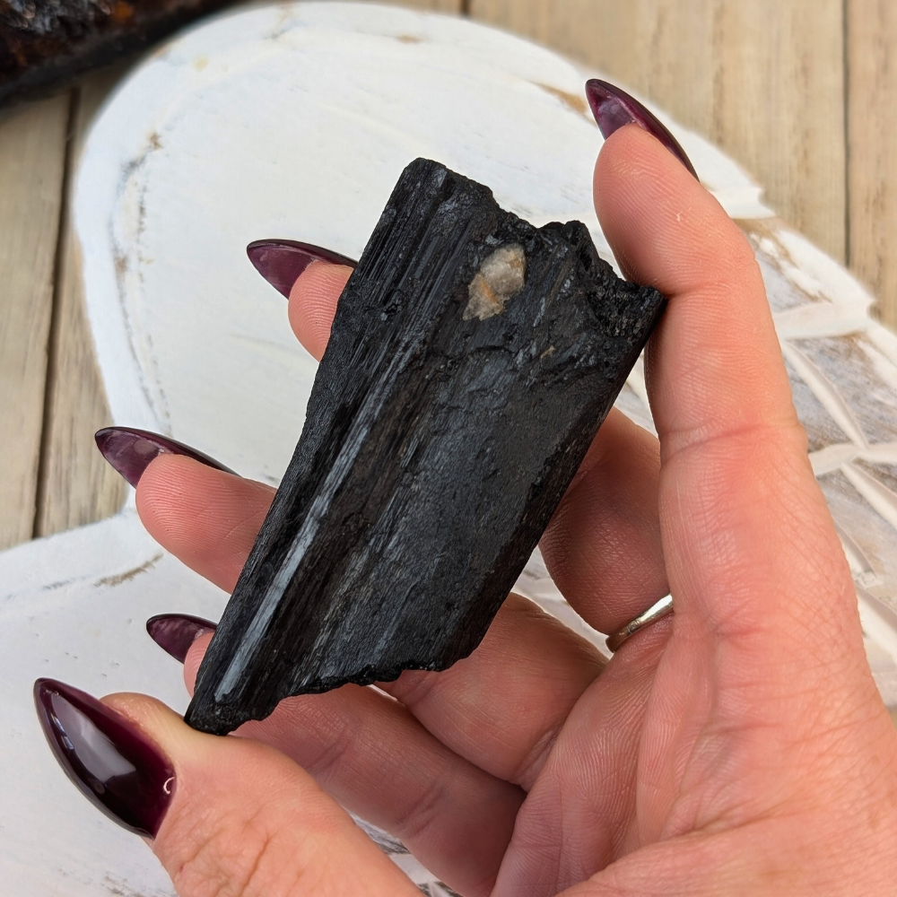 Black Tourmaline Crystal for Protection Rituals - A natural Black Tourmaline crystal, perfect for use in protection rituals, energy cleansing, and grounding practices.