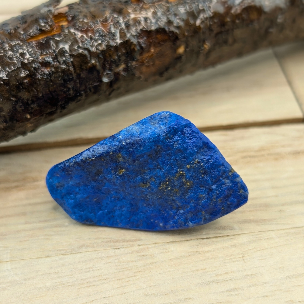 Unpolished Lapis Lazuli crystal with rich textures and vibrant hues.