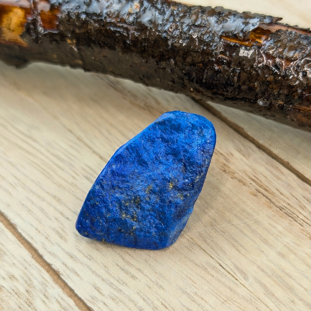 Lapis crystal on a wooden surface, perfect for energy work