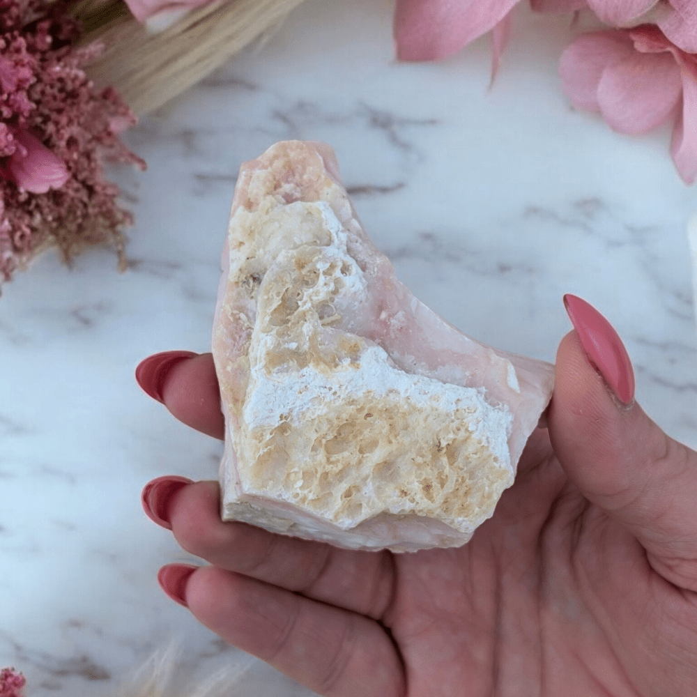 Peruvian Pink Opal stone in hand