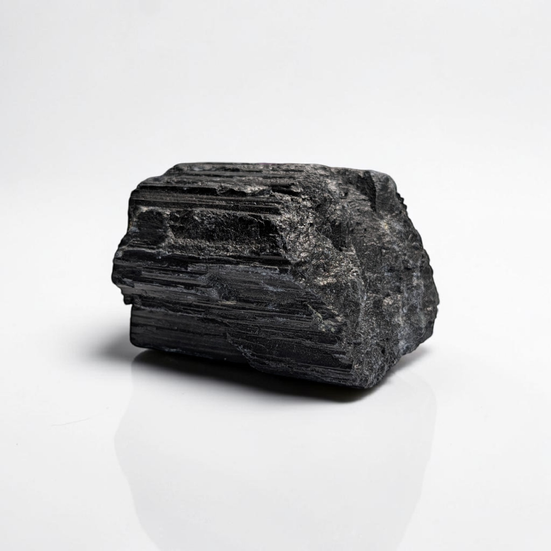Raw Black Tourmaline Crystal for the root chakra and negative energy protection. Find in-store now or online at Zen Collection Metaphysical Store Canada