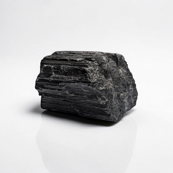 Raw Black Tourmaline Crystal for the root chakra and negative energy protection. Find in-store now or online at Zen Collection Metaphysical Store Canada