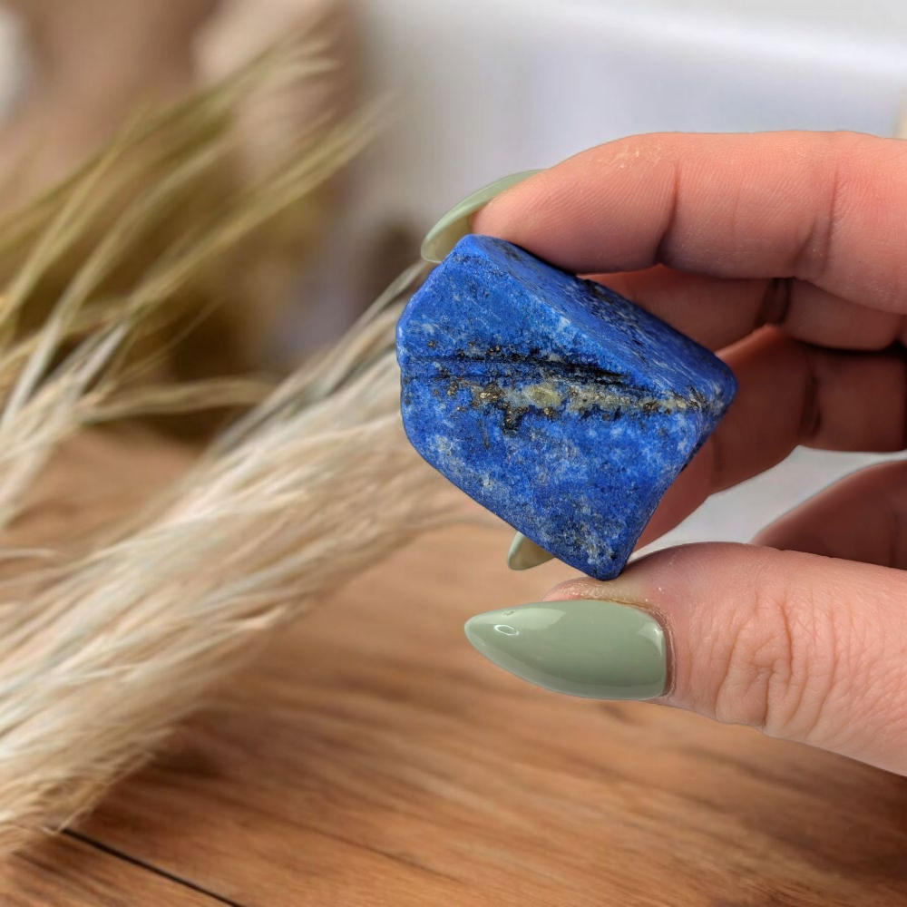 Raw Lapis Lazuli crystal on white background