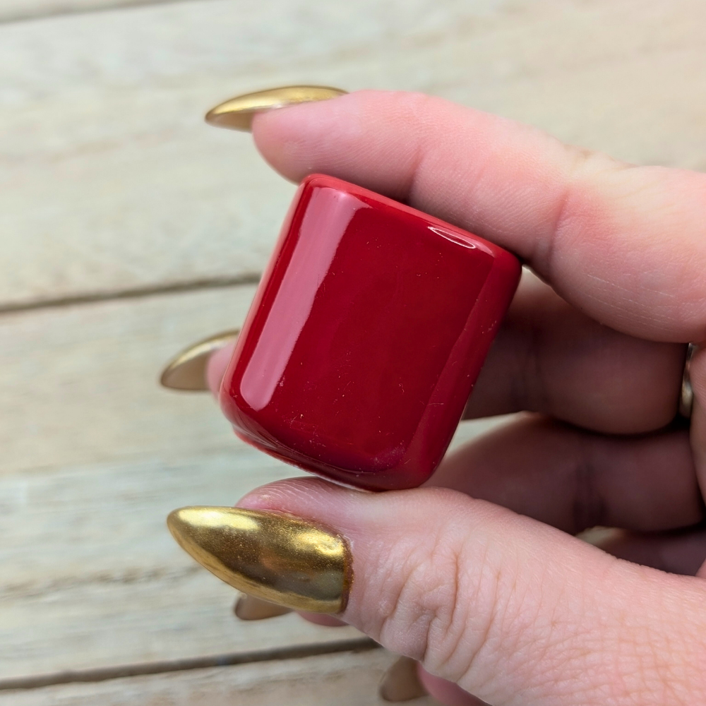 Bold red candle holder for spiritual practices