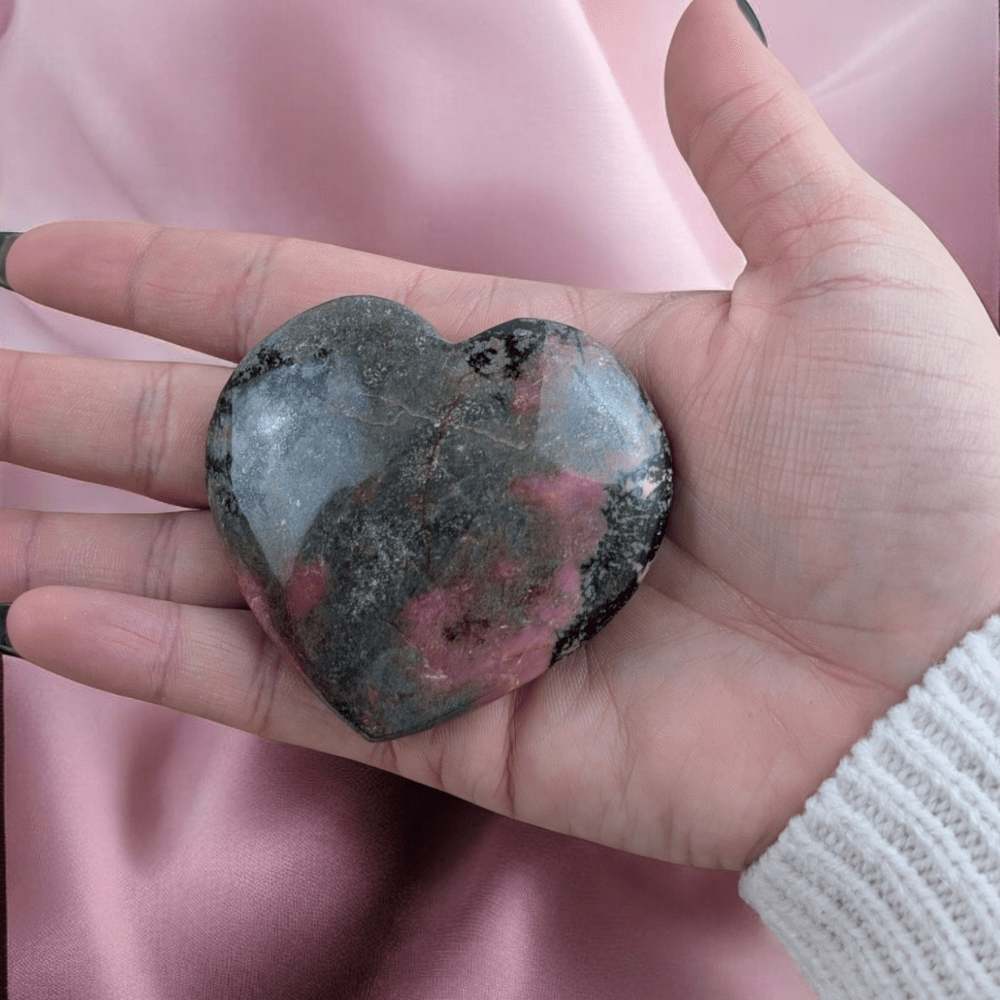 Pink and black Rhodonite crystal heart for chakra healing