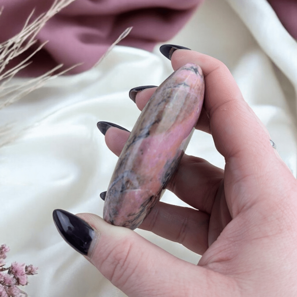 Pink and black Rhodonite healing crystal for balance