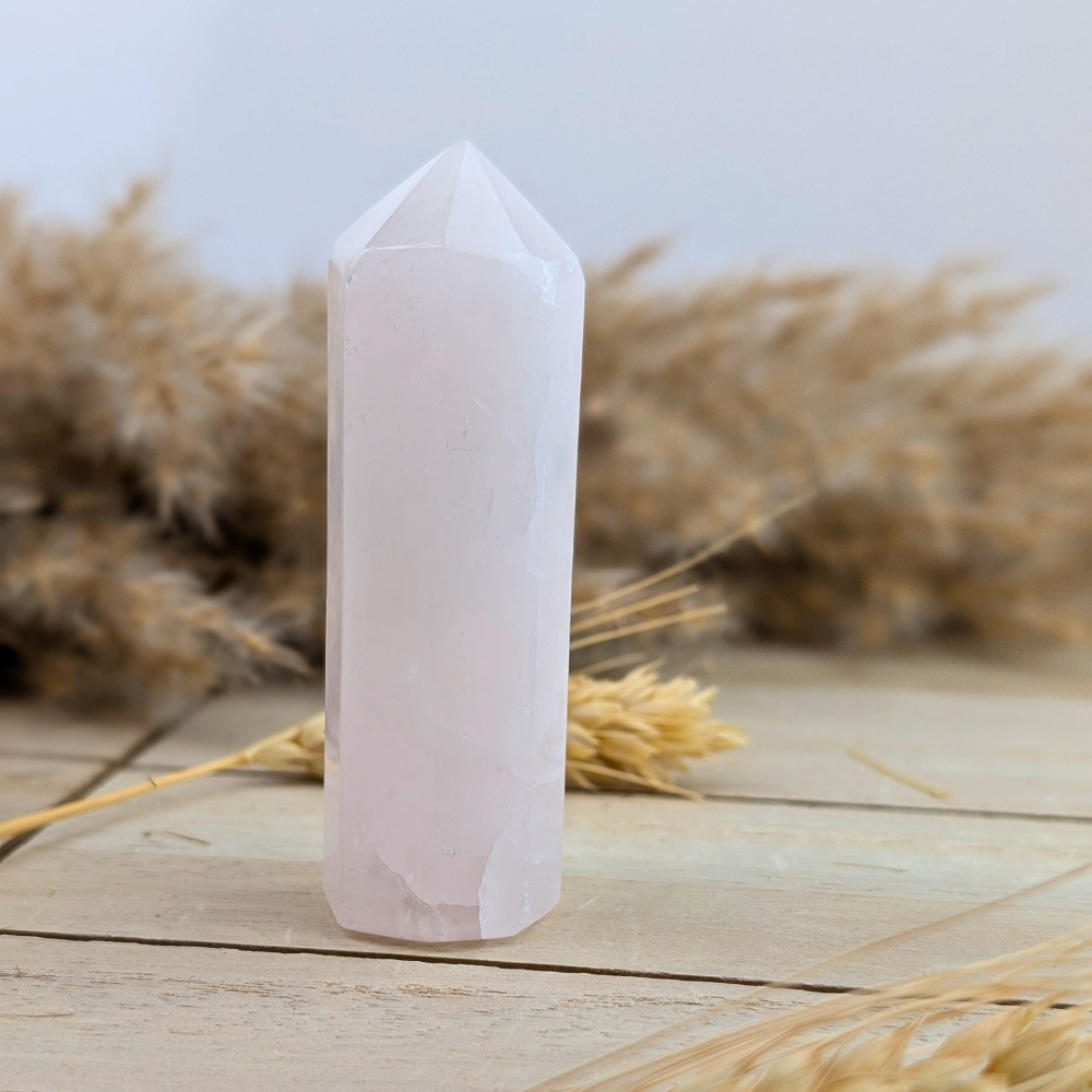 Soft pink rose quartz obelisk for emotional clarity and spiritual connection.