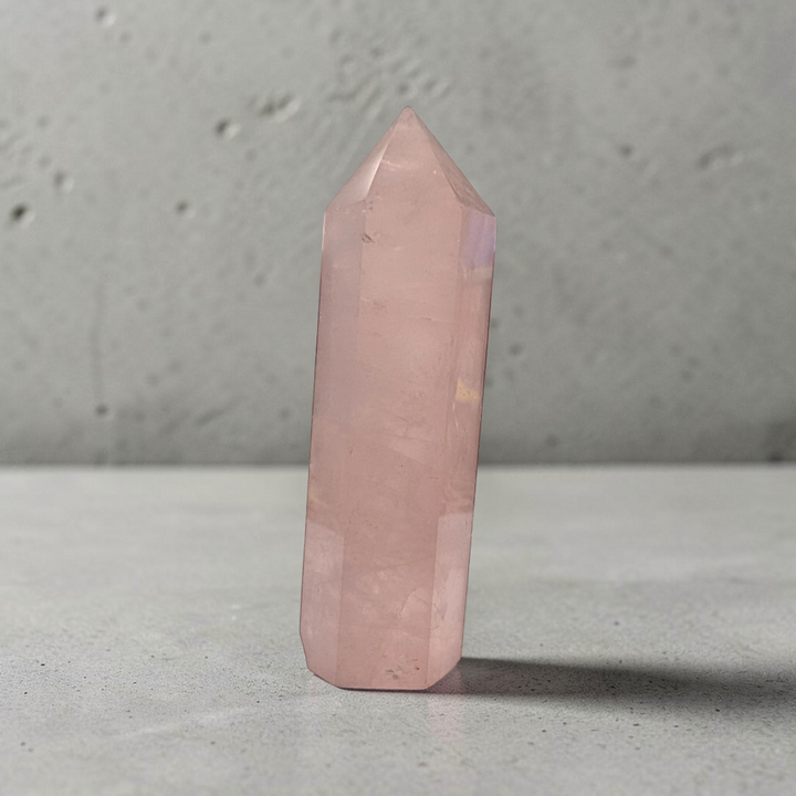 Rose quartz obelisk for chakra work and self-love practices.