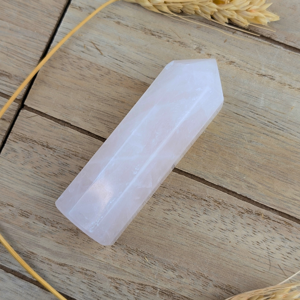 Rose quartz obelisk for chakra work and self-love practices.