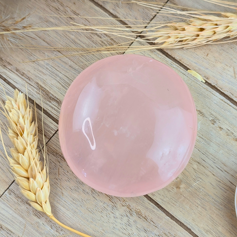 Soft pink rose quartz crystal for self-love and emotional balance.