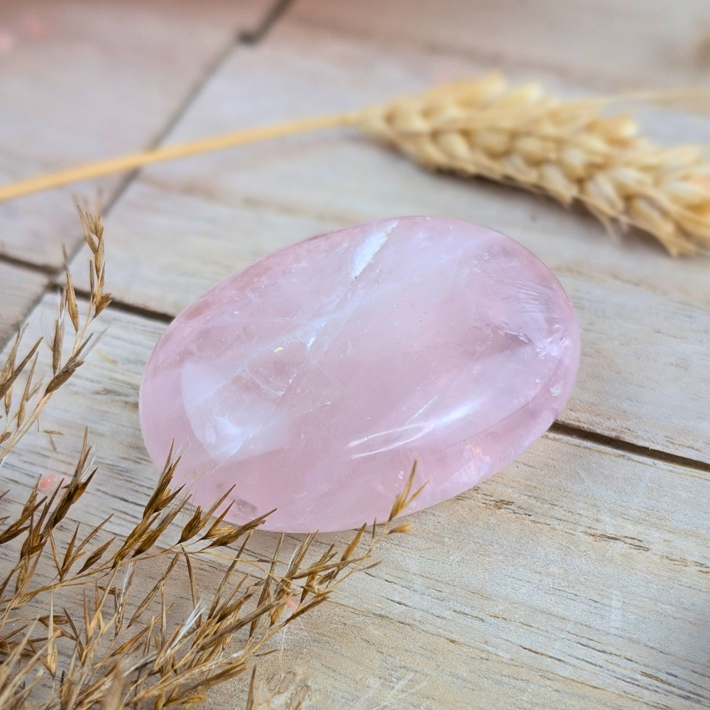 Close-up of Rose Quartz Palm Stone showing natural patterns