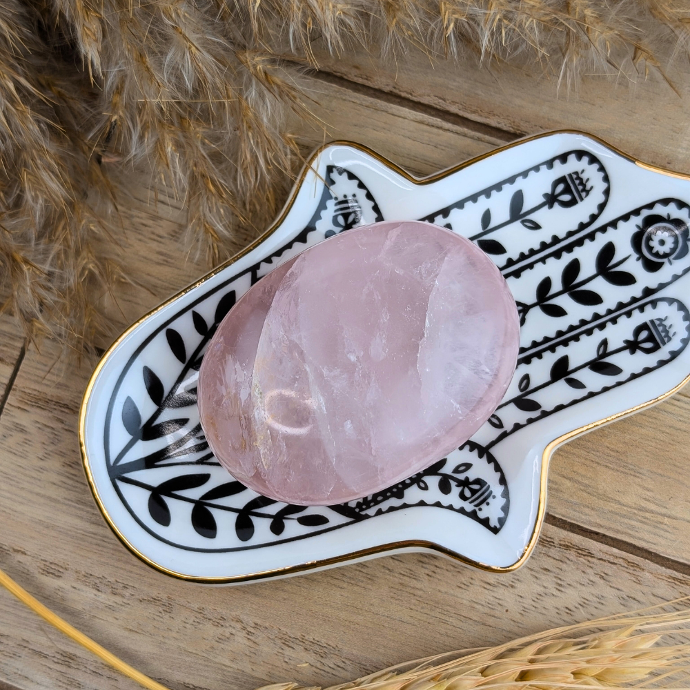 Soft pink rose quartz crystal for emotional balance and chakra work.