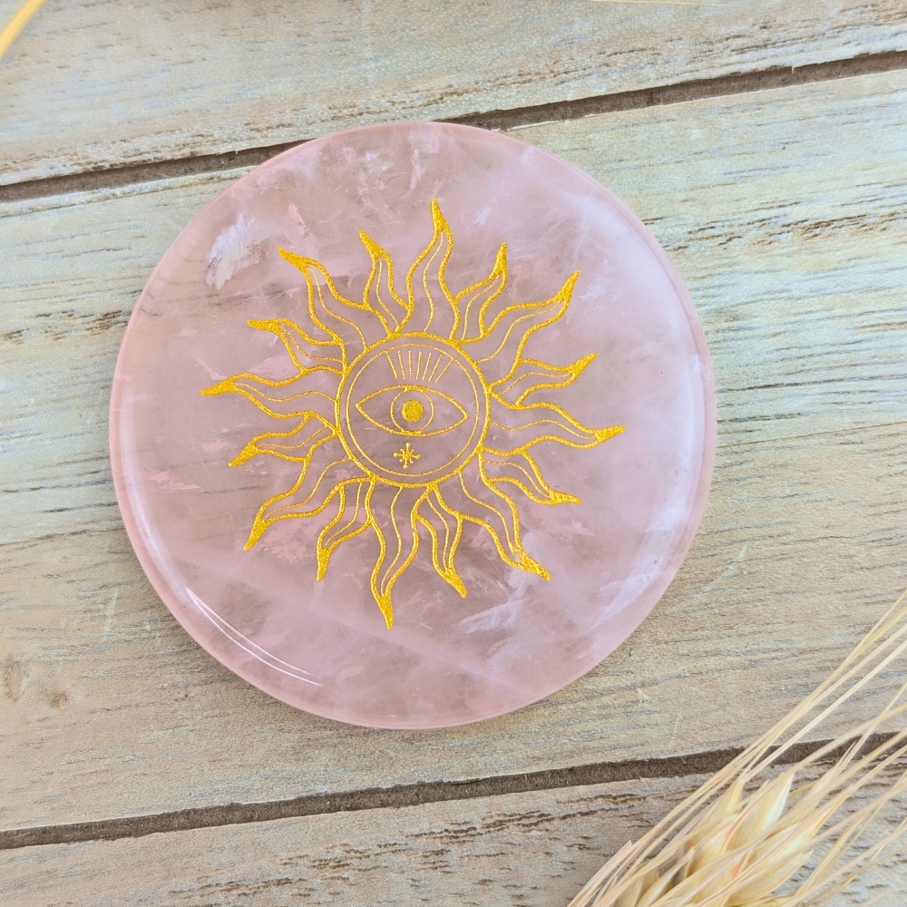 Soft pink rose quartz plate for meditation and heart chakra alignment.