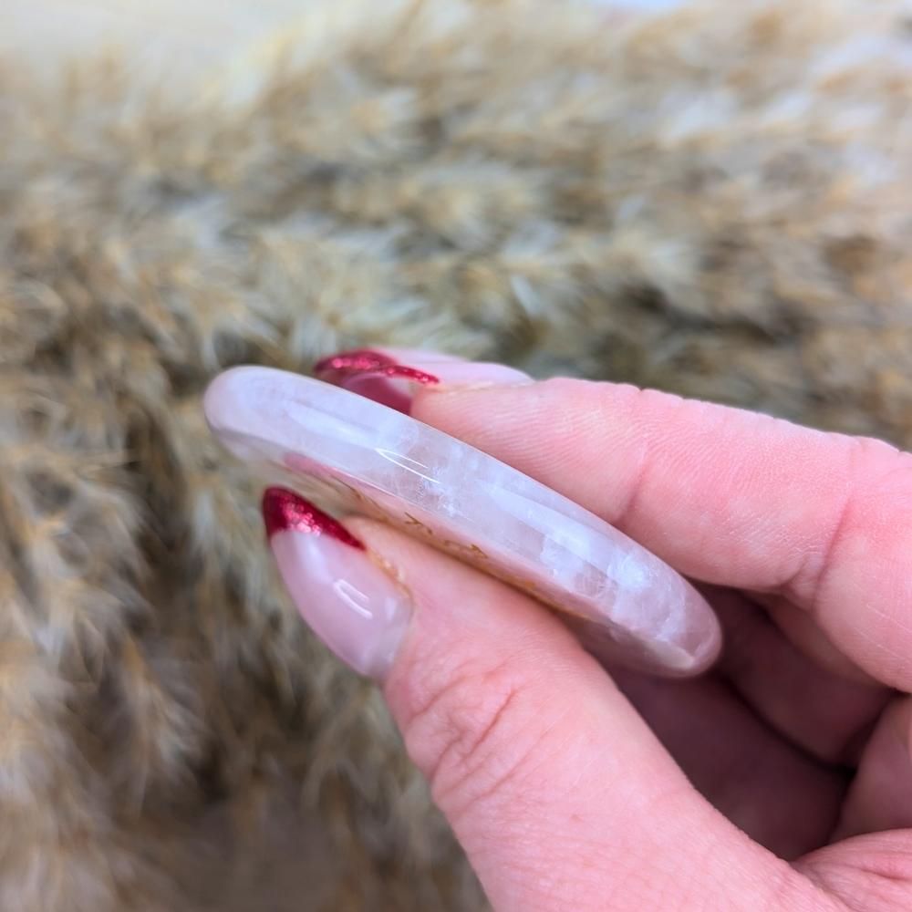 Rose quartz protection plate for opening the heart chakra and promoting self-love.