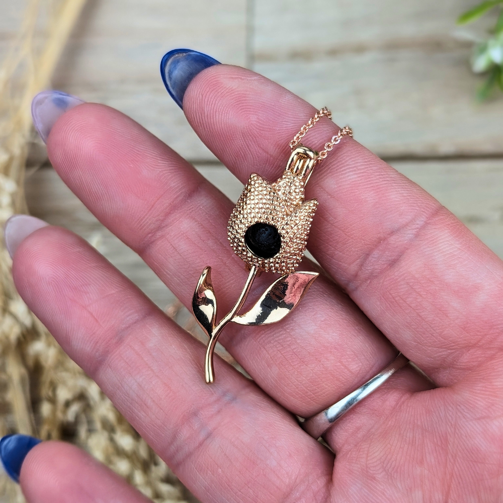 Aromatherapy necklace with floral design and lava stone