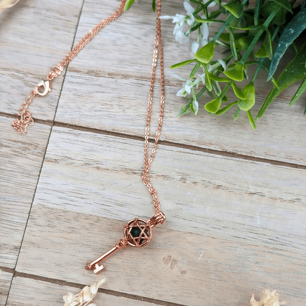 Compact rose gold aromatherapy necklace for diffusing essential oils