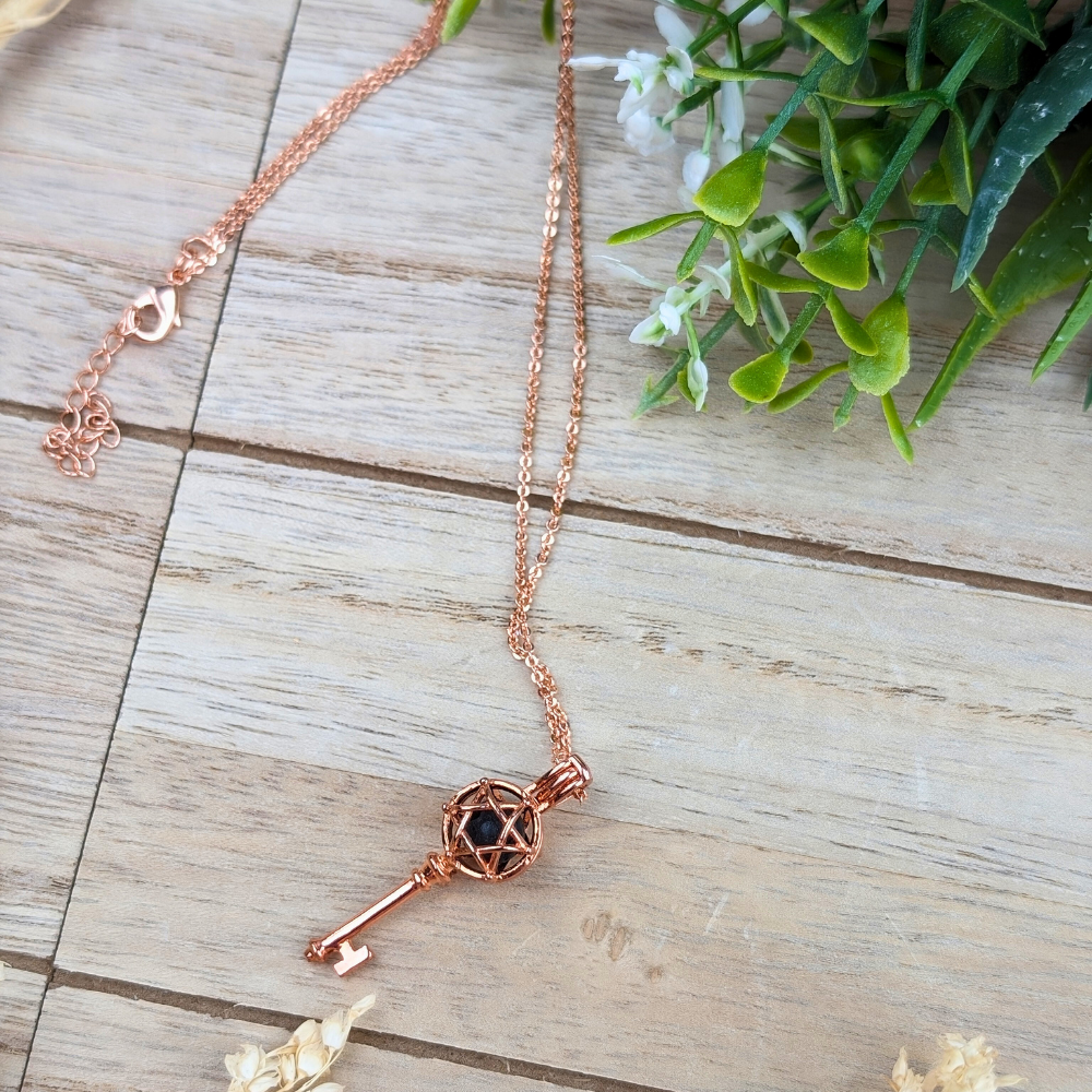 Compact rose gold aromatherapy necklace for diffusing essential oils