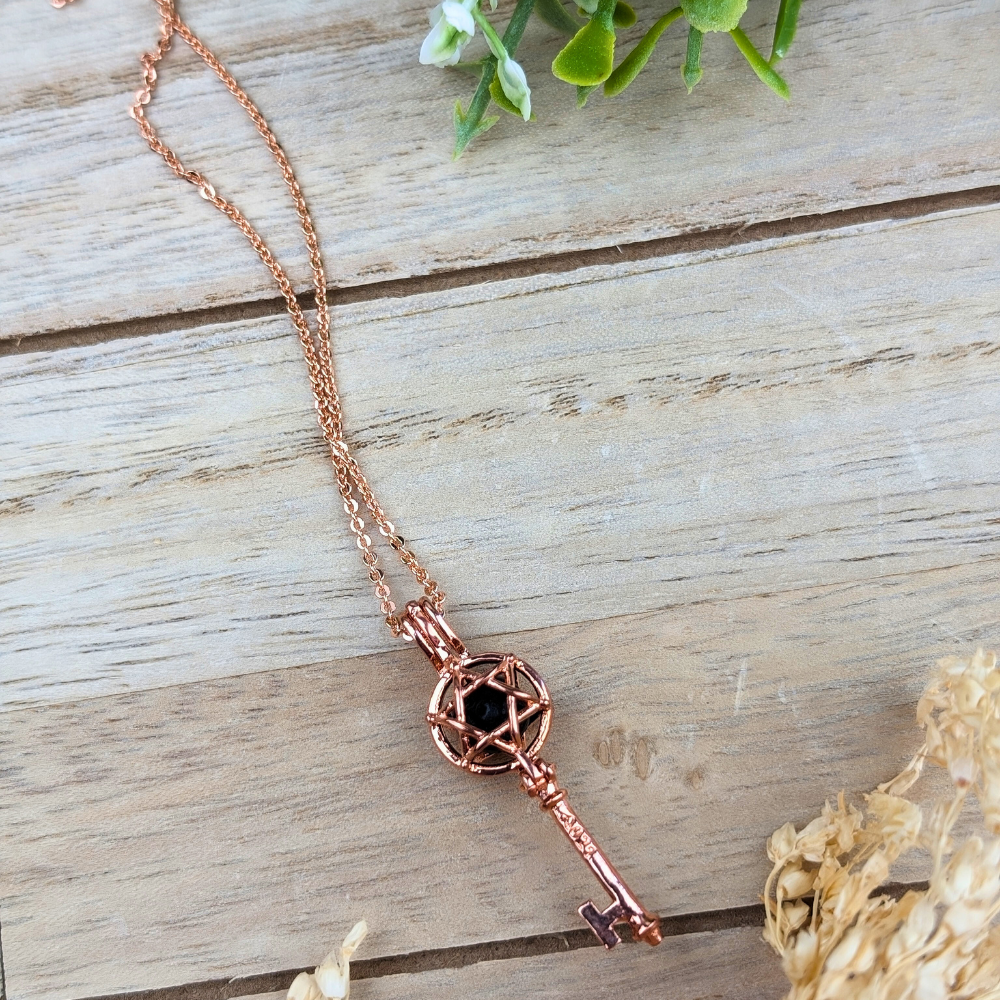 Stylish rose gold aromatherapy necklace releasing essential oil fragrance